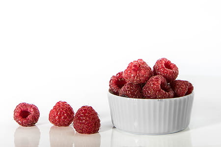 raspberries on white ceramic bowl thumbnail