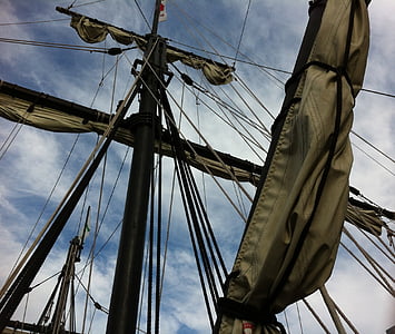white pirate ship under white cloudy sky thumbnail