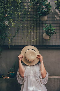 Woman Holding a Brown Hat thumbnail