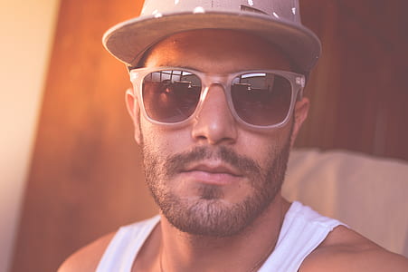 selective focus photograph of man in white tank top thumbnail