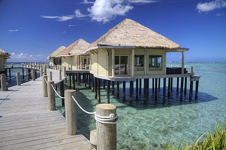 landscape photography of houses near body of water thumbnail