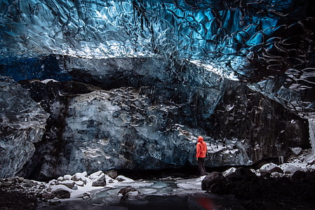 person standing in front of cave thumbnail