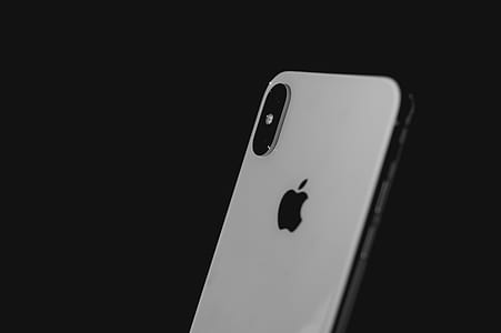 focus photography of silver iPhone X thumbnail