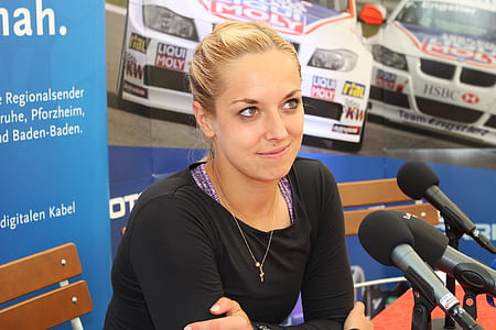 woman in front of microphones thumbnail