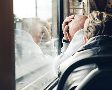 person leaning on glass window thumbnail