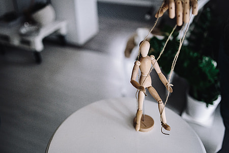 Wooden mannequin in various poses thumbnail