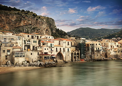 houses near sea at daytime thumbnail