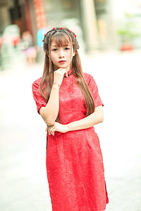 woman wearing red standing on park thumbnail