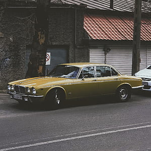 green sedan on gray concrete road thumbnail