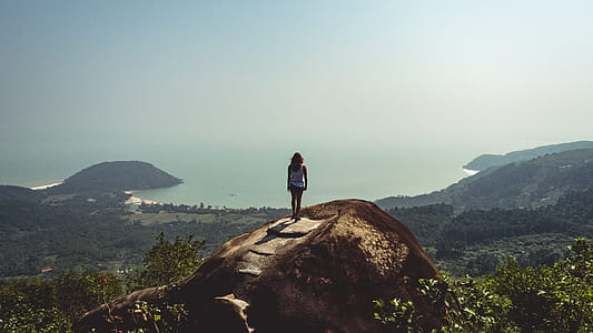 woman standing on mountain thumbnail