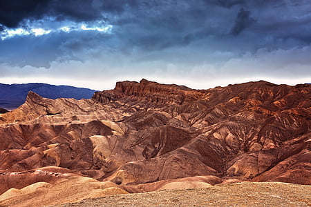 brown cover by sand mountain under cloudy sky thumbnail