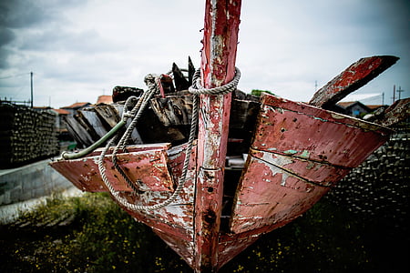 closed-up photo of broken brown wooden boat on soil thumbnail