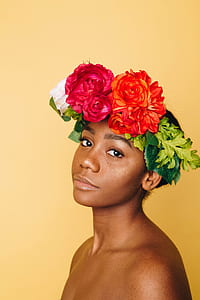 woman wearing orange, red, and white rose flowers headdress thumbnail