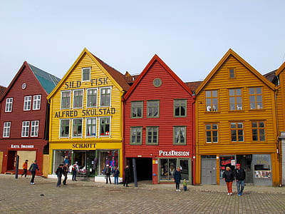 group of people walking beside buildings during daytime thumbnail