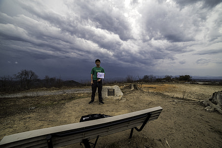 Claiming South Carolina by right of Conquest under Dramatic skies at Sassafras Mountain thumbnail