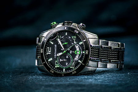 round black, green, and white chronograph watch displaying 11:10 thumbnail