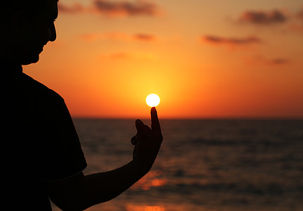 man pointing on sunset thumbnail