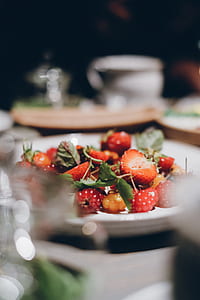 red raspberries and strawberries on white ceramic plate thumbnail