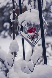 gray and red hanging decor covered with snow thumbnail