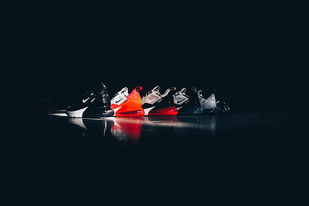 assorted Nike shoes on black board thumbnail