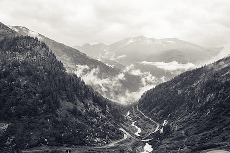 grayscale photo of foggy mountaiuns thumbnail