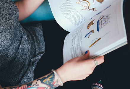 person holding book thumbnail