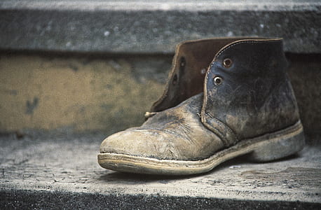 close-up photo of unpaired brown leather shoe thumbnail