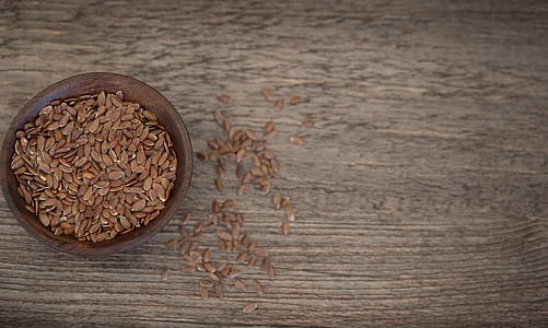 brown ceramic bowl on wooden surface thumbnail