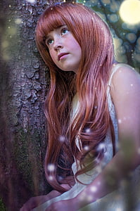 girl wearing white sleeveless dress leaning her head in tree while looking up thumbnail