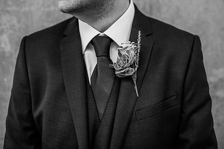 grayscale photography of man wearing suit jacket thumbnail