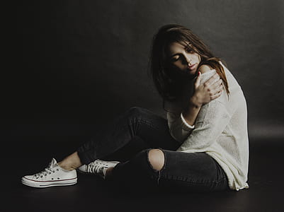 Woman in White Top and Black Distress Jeans thumbnail