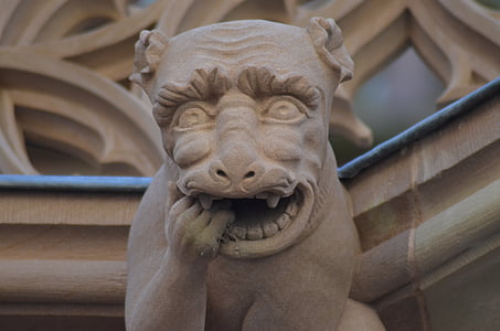 close-up photography of brown concrete gargoyle thumbnail