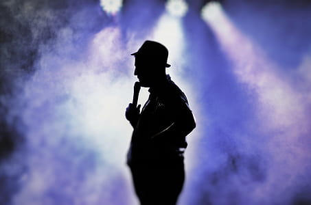 Man Holding Microphone Silhouette thumbnail