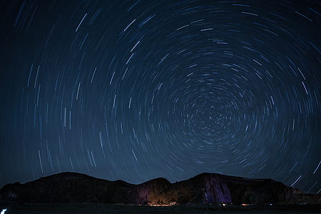 brown rock formations at nighttime thumbnail