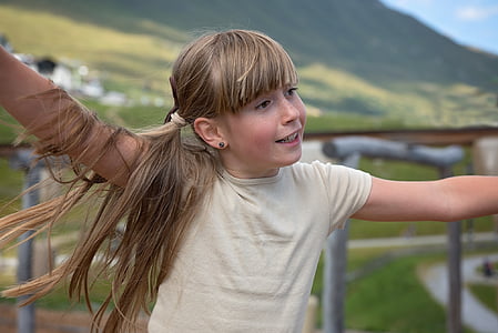 selective focus photography of girl in yellow shirt thumbnail