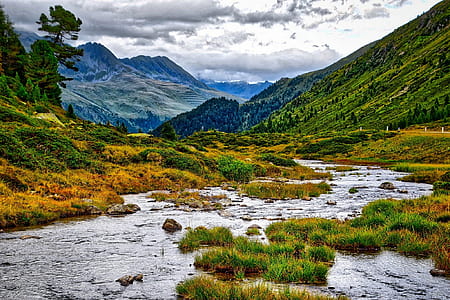 landscape photography of river near mountain thumbnail
