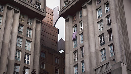brown concrete building at daytime thumbnail