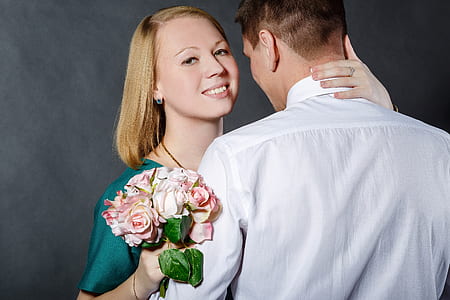 woman holding neck of man thumbnail