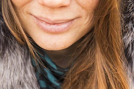 Smiling Woman Wearing Gray Fur Top thumbnail