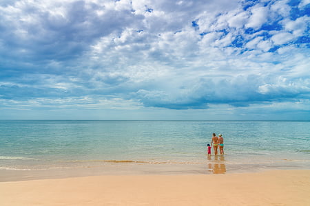 group of people on beach during daytime thumbnail