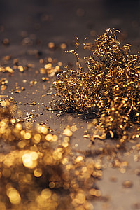 Close-ups of golden metal shavings on a table thumbnail
