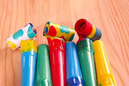 several assorted-color plastic containers on beige surface thumbnail