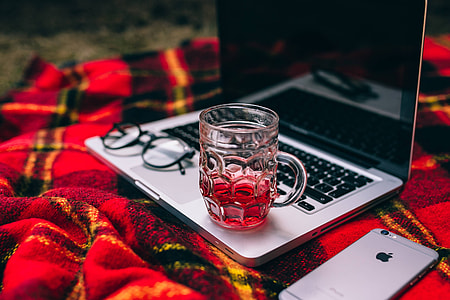 Apple Macbook on a red blanket thumbnail