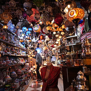 man standing inside store full of lanterns thumbnail