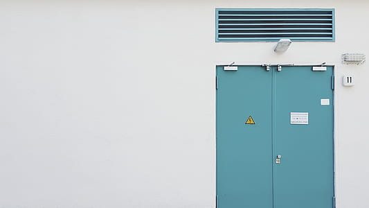 closed blue wooden door thumbnail