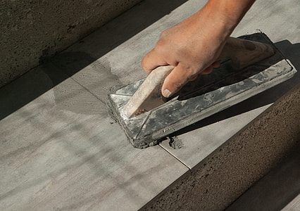 person holding finishing trowel thumbnail