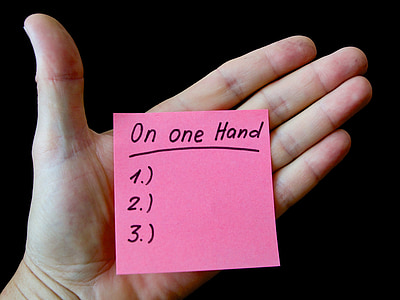 person holding pink sticky note thumbnail