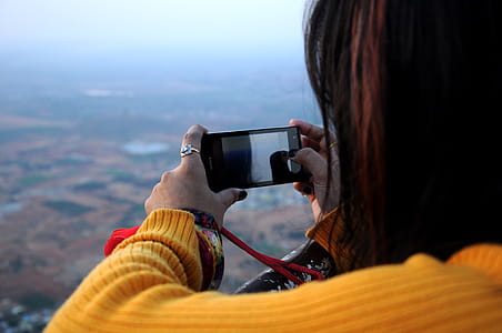 Photo of Woman Taking Picture thumbnail