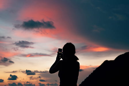 silhouette of woman using smartphone thumbnail