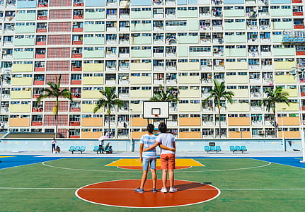 two person standing on basketball court thumbnail